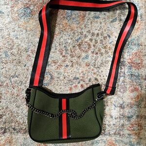 HAUTE SHORE Neoprene Stylish Green Crossbody Bag with Red and Black Stripes